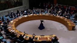 Russia's representative to the United Nations, Vasily Nebenzya, keeps his hand down during a vote on a draft resolution that would condemn Russia for invading Ukraine, February 25, 2022