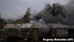 UKRAINE -- Smoke rise from an air defense base in the aftermath of an apparent Russian strike in Mariupol, February 24, 2022. 