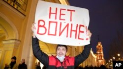 A demonstrator holds a sign reading "No to war!" at a protest in St. Petersburg against Moscow's invasion of Ukraine on February 24. 