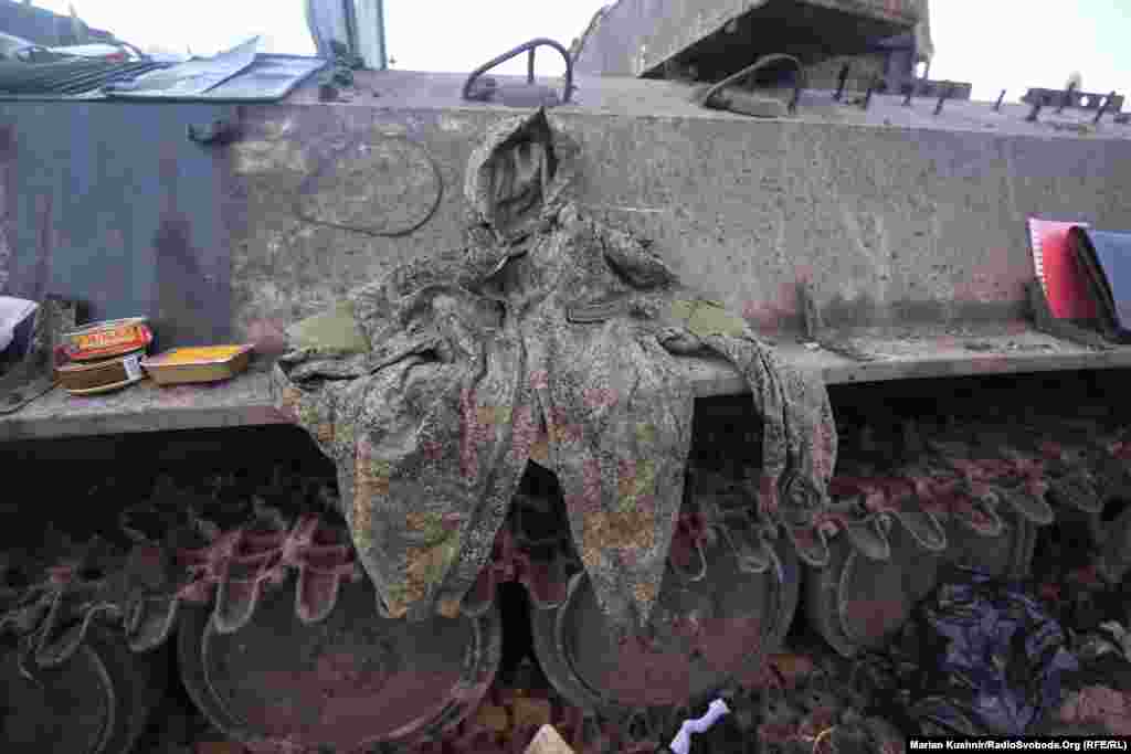 The jacket of an unidentified Russian soldier is spread on the side of an armored vehicle.&nbsp;
