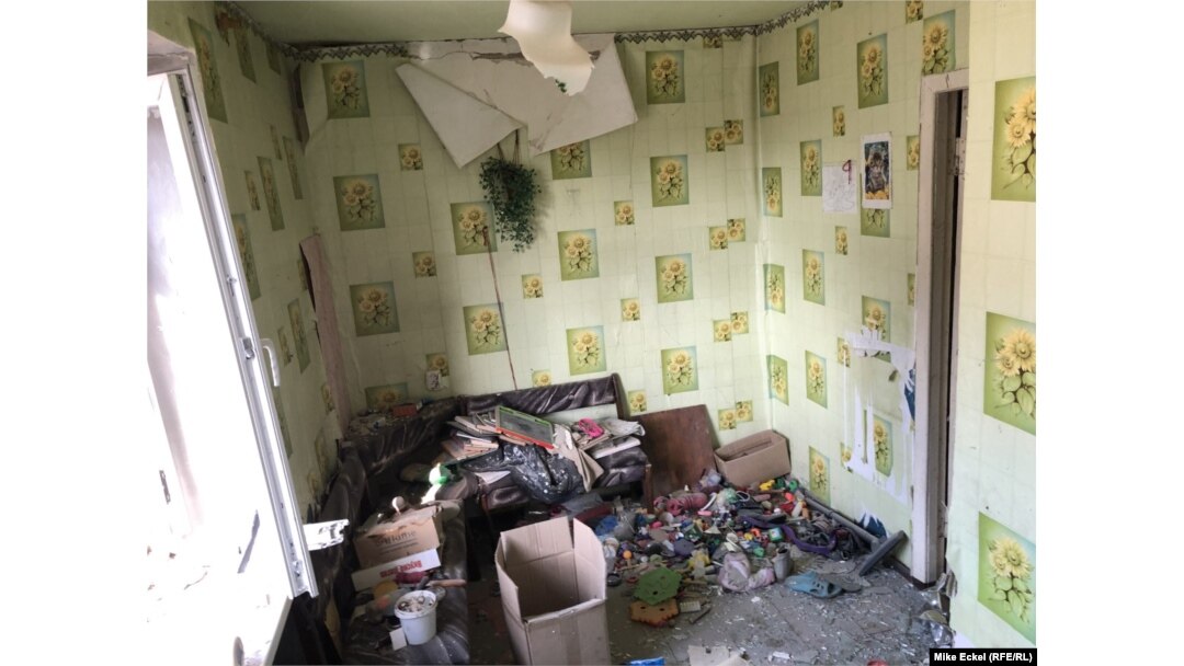 A barrage of Grad rockets -- purportedly fired from Russia-backed separatist forces --- hit close to an apartment block in the town of Tryokhizbenka in eastern Ukraine, damaging many people's homes.