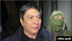 Bolot Temirov is detained by security forces in Bishkek on January 23.