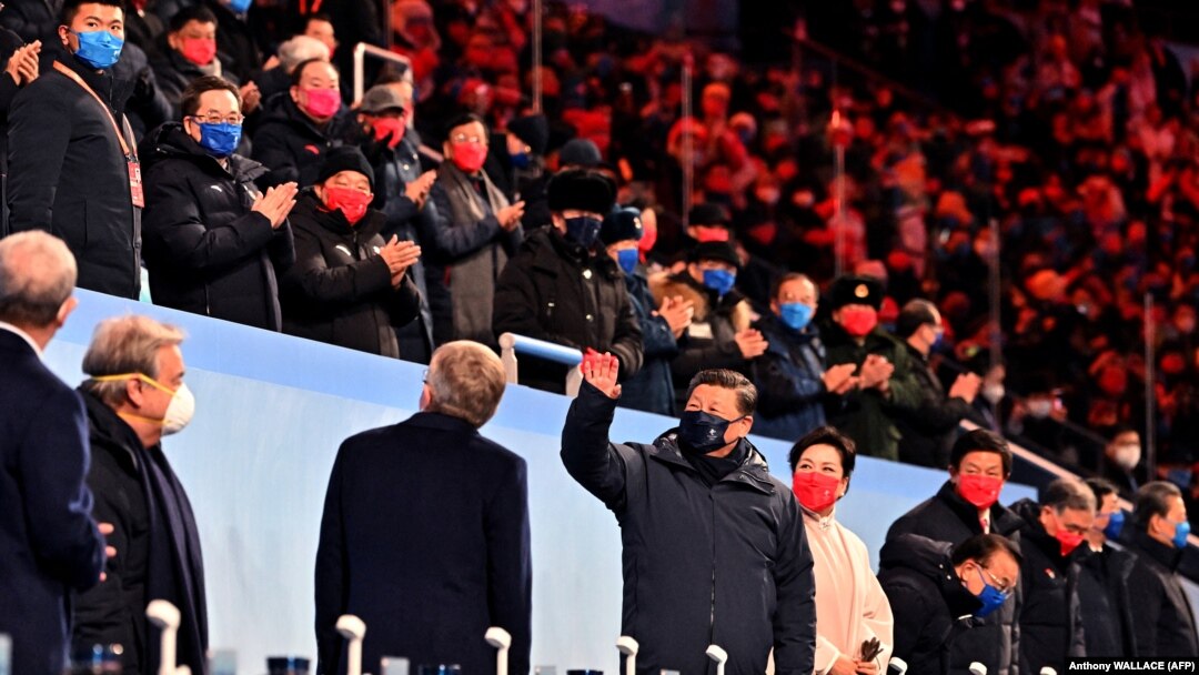 Chinese leader Xi Jinping (center) greets the crowd during the opening ceremony of the Beijing Winter Olympics on February 4. 