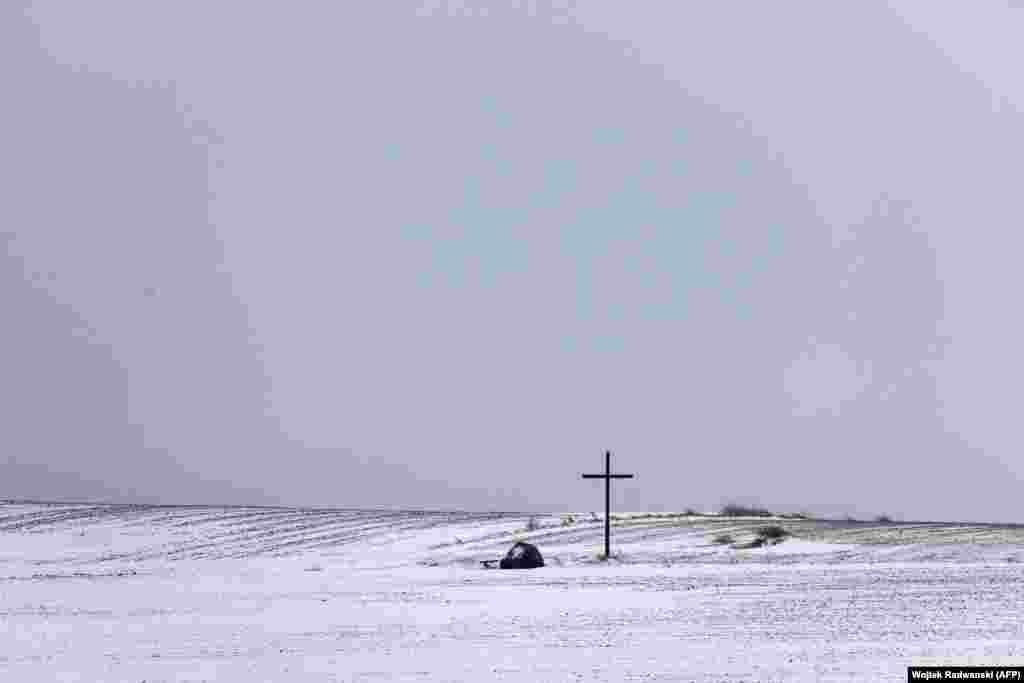 A cross erected near the Polish-Belarusian border near Szudzialowo on January 25. The Poland-Belarus border wall is scheduled to be completed by June 2022. &nbsp;