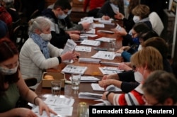 Volunteers prepare the leaflets in Budapest on February 1.