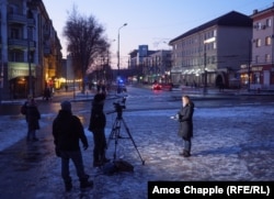 A crew from the China Global Television Network films a live report from central Mariupol on February 6.