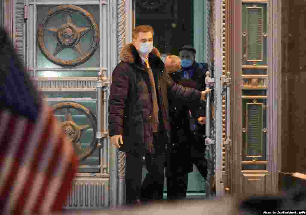 John Sullivan, the U.S. ambassador to Russia (in black face mask) leaves the Russian Foreign Ministry in Moscow on January 26. Sullivan delivered a written U.S. response to Russian demands for security guarantees over NATO and Ukraine.