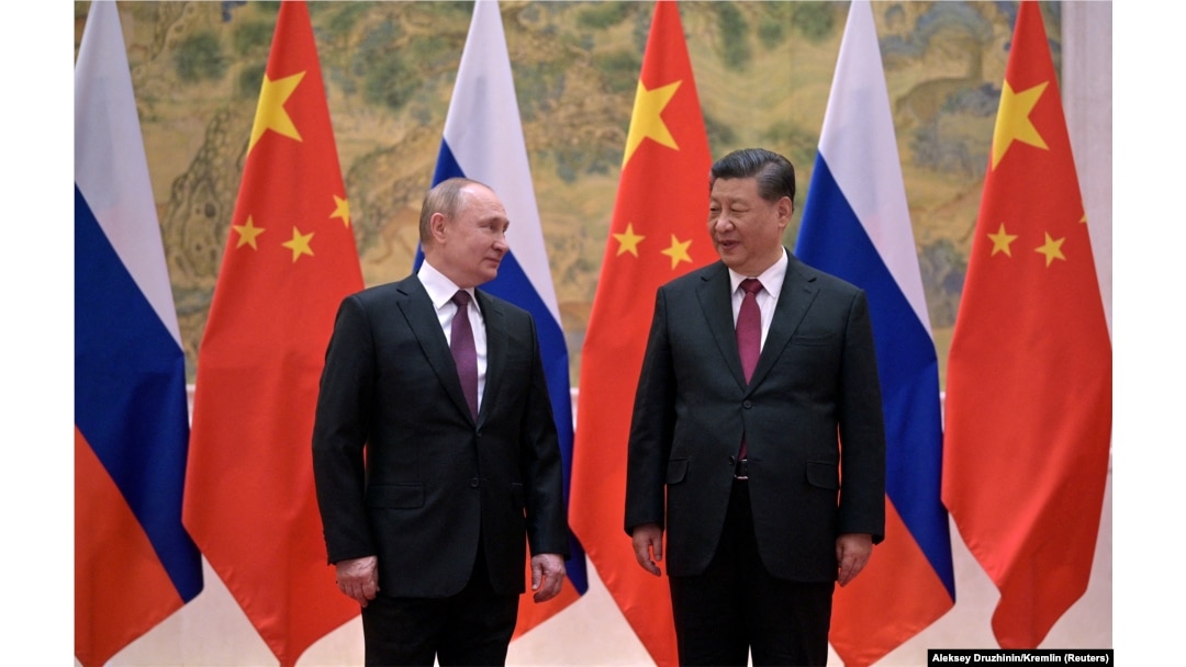 Russian President Vladimir Putin (left) attends a meeting with Chinese President Xi Jinping in Beijing on February 4.