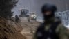 Poland -- Polish border guard officers and soldiers are seen during the construction of a border wall along the Polish-Belarus border