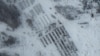 A satellite image shows Russian tanks and artillery support equipment parked in Yelnya, Russia January 19, 2022