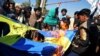 Protesters burn a Swedish flag during a demonstration in Kandahar on January 25. The demonstration followed the burning of a Koran by a far-right politician in Stockholm. In June, an Iraqi immigrant also burned a Koran outside a Stockholm mosque.