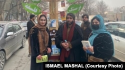 Professor Ismail Mashal (center), an Afghan academic, was arrested by the Taliban for protesting its ban on women's education.