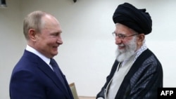 Iranian Supreme Leader Ayatollah Ali Khamenei receives Russian President Vladimir Putin in Tehran on July 19, 2022.