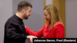 Italian Prime Minister Giorgia Meloni speaks with Ukrainian President Volodymyr Zelenskiy at a bilateral meeting with EU leaders in Brussels on February 9.