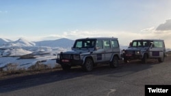 Armenia - Vehicles carrying EU monitors are seen near the Armenian-Azerbaijani border. 