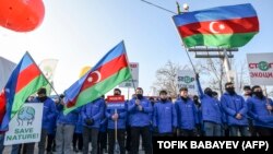 Azerbaijanis protest what they claim is illegal mining at the Lachin Corridor, the Armenian-populated breakaway Nagorno-Karabakh region's only land link with Armenia.