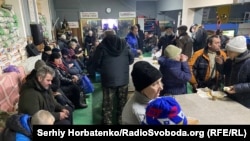 Bakhmut residents gather at one of the volunteer-run "Points of Invincibility" to get a warm meal, recharge their phones, and share a sense of community as Russian forces continue to pummel the city in Ukraine's Donetsk region. 