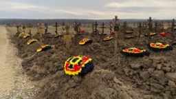 During a recent trip to the cemetery in Bakuskaya, rows of freshly dug graves could be seen, as well as newly made walls meant to house cremated remains.