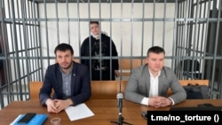 Zarema Musayeva in a defendant's cage at a court hearing in, Grozny, Chechnya, on February 2. 
