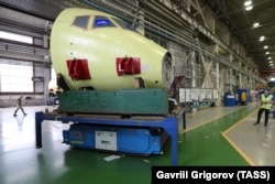 Assembling a Sukhoi Superjet 100 passenger plane at the Gagarin Komsomolsk-on-Amur aircraft factory in 2019.