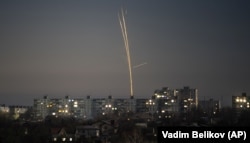 Russian rockets launched against Ukraine from Russia's Belgorod region are seen at dawn in Kharkiv on February 8.