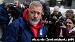 Dmitry Muratov leaves the Moscow City Court after a ruling on Novaya Gazeta's appeal against an earlier verdict in Moscow on February 7. 