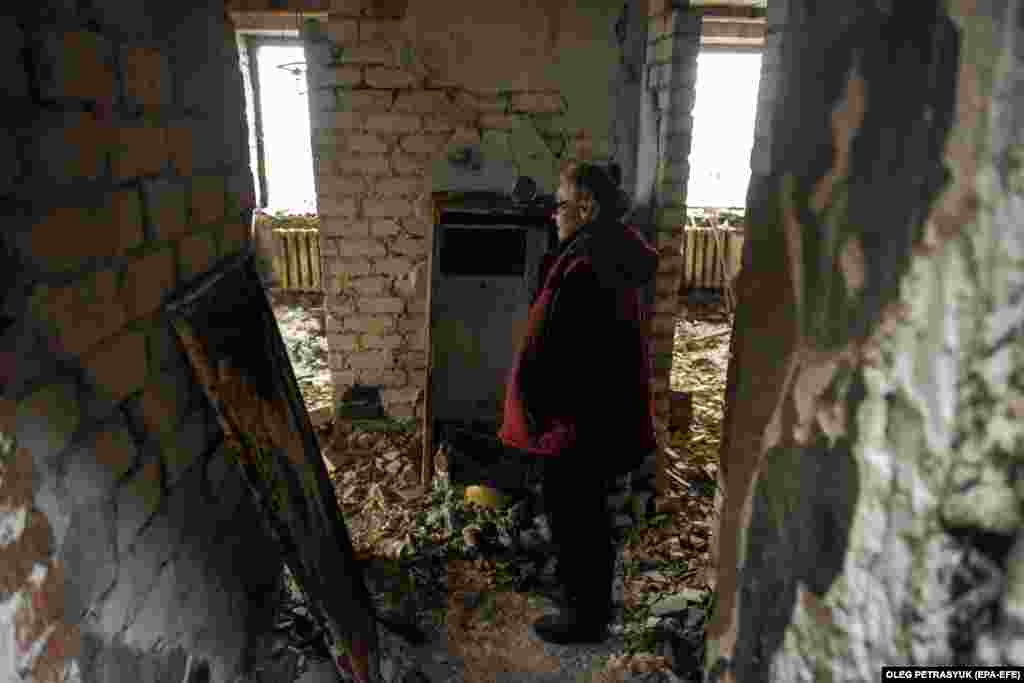 Standing amid the ruins of her former home, Lyubov was one of those who remained during the Russian occupation. Many of those who did not flee were elderly, poor, or caring for sick relatives. &nbsp;