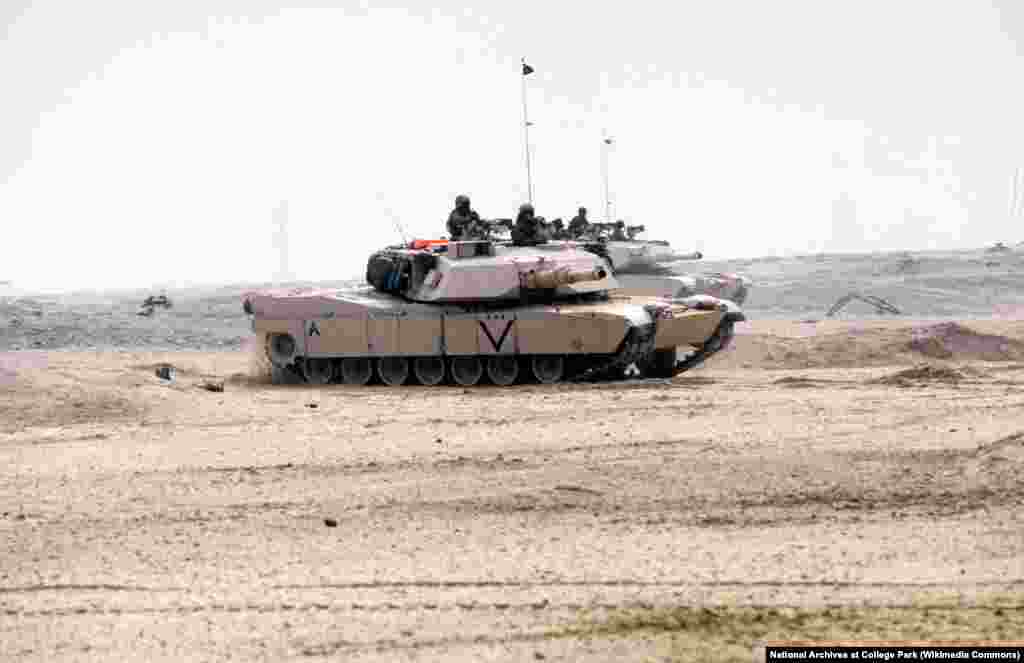 Two Marine Corps M-1A1 Abrams main battle tanks move across the desert during the ground phase of Operation Desert Storm on February 24, 1991.&nbsp;Though the M1 Abrams entered service in 1980, Desert Storm was its first time in combat. &nbsp;