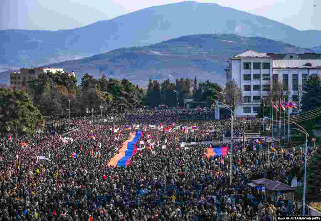 With the blockade threatening food, medicine, and fuel supplies to Nagorno-Karabakh&#39;s 120,000 people, thousands of Armenians took to the streets in Stepanakert on December 25 to protest against Azerbaijan.
