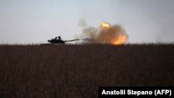 A Ukrainian tank fires toward Russian positions near the town of Bakhmut in the eastern Donetsk region on January 26.