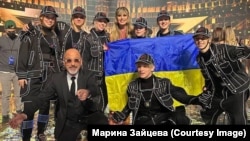 Members of the Ukrainian Light Balance Kids dance troupe pose with judges after their spectacular performance earlier this month on the popular TV show America`s Got Talent All Stars. 