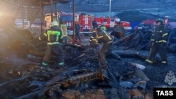 Firefighters battle a deadly blaze at an accommodation facility for construction workers in Crimea on February 2. 