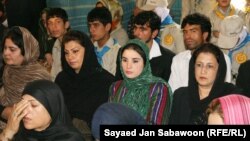 Afghan women listen to a speech by Afghan President Hamid Karzai during an event marking International Literacy Day in Kabul on September 28, 2010.