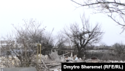 Руины дома в селе Правдино, в котором российские военные убили и взорвали шестерых мужчин и девочку-подростка. Дата снимка: январь 2023 года