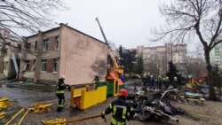 Ukrainian Emergency Workers Cover Bodies At Helicopter Crash Site