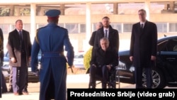 Serbian President Aleksandar Vucic (right) welcomes Czech President Milos Zeman (seated) to Belgrade on January 30.