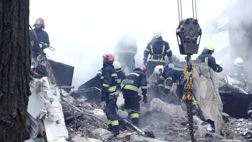 Rescuers Scramble To Aid Survivors Of Deadly Russian Strike On Dnipro Apartment Block
