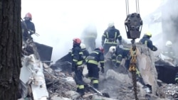 Rescuers Scramble To Aid Survivors Of Deadly Russian Strike On Dnipro Apartment Block

