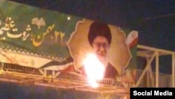 Videos posted on social media in recent days have shown protesters in several Iranian cities set fire to propaganda banners hung by the government to promote the revolution and anniversary celebrations around it.