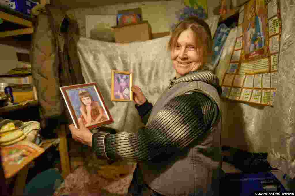 Yet the residents try to create a sense of normalcy, such as a smiling Svitlana, pictured with photos of her granddaughter.