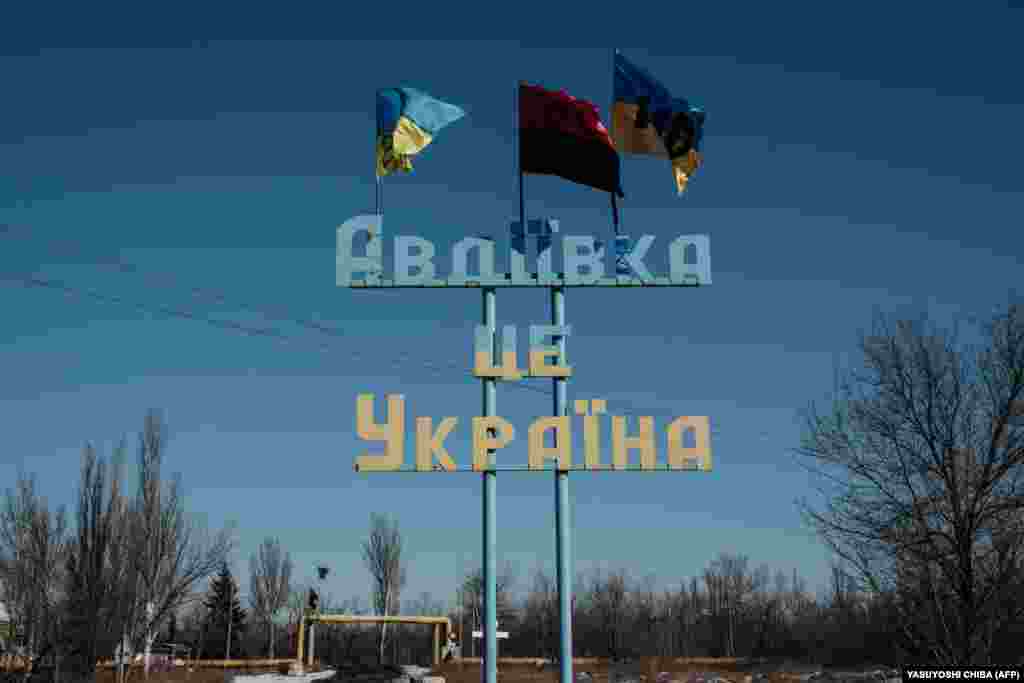 Ukrainian flags fly above the &quot;Avdiyivka is Ukraine&quot; monument.&nbsp;