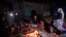 People gather around a fire after an earthquake in Khoy, Iran, on January 29.