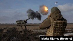 Ukrainian military personnel from the 43rd Heavy Artillery Brigade fire a German Panzerhaubitze self-propelled gun at positions of the Russian Army near Bakhmut on February 5.