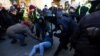 Police officers detain an anti-war demonstrator in St. Petersburg on February 27.