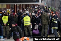Refugees from Ukraine arrive at the railway station in Przemysl, Poland, on February 27.