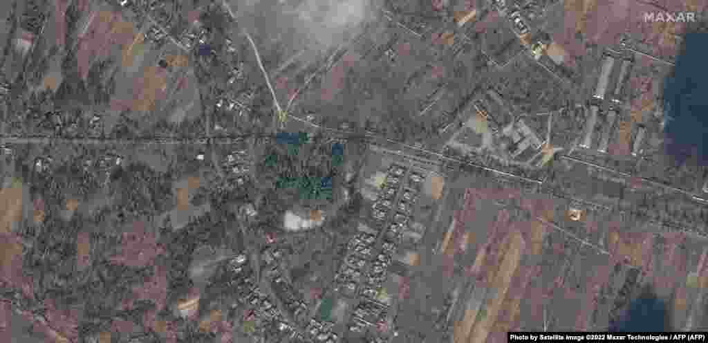 A column of Russian military vehicles is seen on February 27 as it moves toward Kyiv on the Shevchenka Road on the outskirts of Ivankiv.