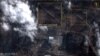 A satellite image with overlaid graphics shows military vehicles alongside the Chernobyl nuclear power plant on February 25.