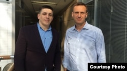 Andrei Borovikov (left), who was sentenced to 2 1/2 years in prison, with Aleksei Navalny