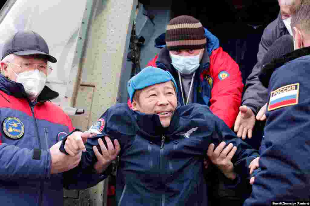 Space flight participant and Japanese entrepreneur Yusaku Maezawa disembarks from a helicopter as he arrives at Zhezkazgan airport upon returning from the International Space Station on a Soyuz MS-20 space capsule on December 20.&nbsp;