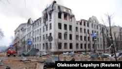 Firefighters work to extinguish a fire at the Kharkiv National University building, damaged by Russian shelling, in Kharkiv on March 2.